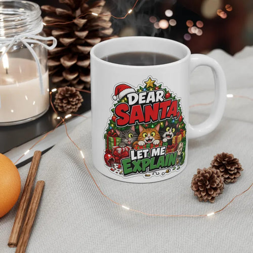 White handled mug with three cats, Christmas presents, and Dear Santa Let Me Explain lettering.