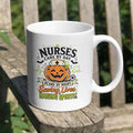 White handled mug with a pumpkin nurse, bats, and Nurses Care by Day Scare by Night lettering.