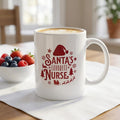 White handled mug with deep-red Santa’s Favorite Nurse lettering, a Santa hat, snowflakes, trees, and a sleigh.