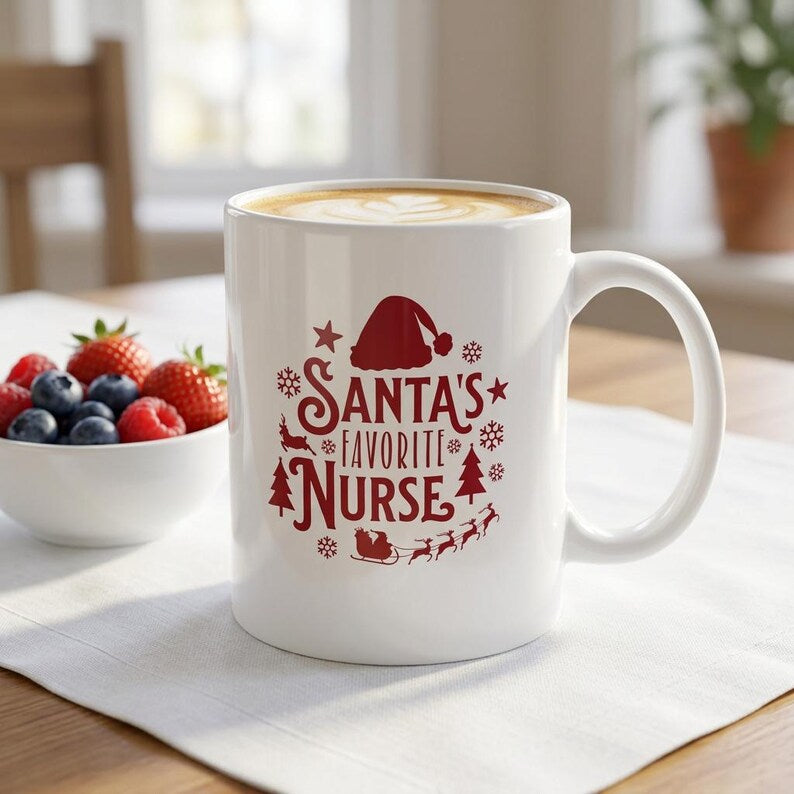 White handled mug with deep-red Santa’s Favorite Nurse lettering, a Santa hat, snowflakes, trees, and a sleigh.